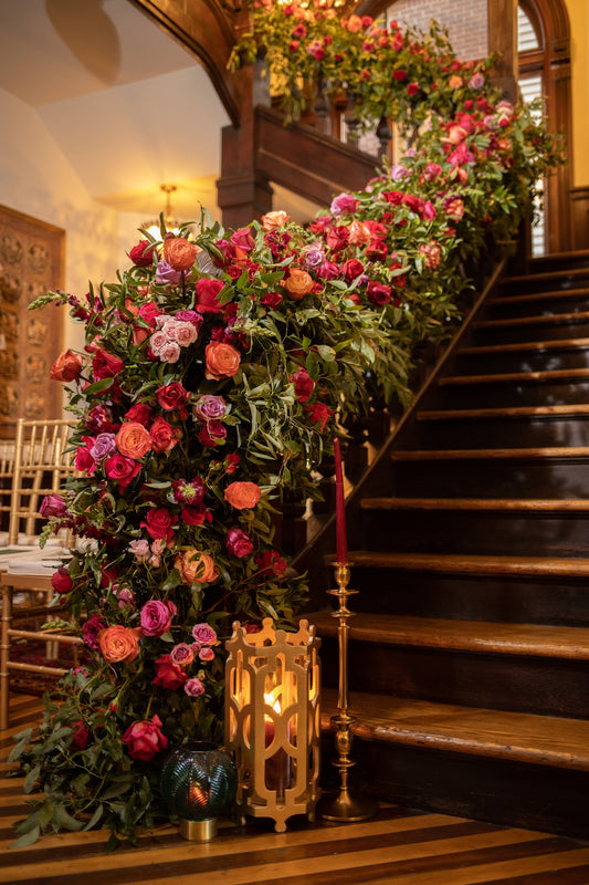 Decorative floral arrangement on a staircase with warm lighting